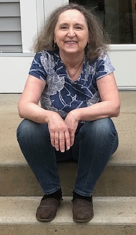 Nancy Keeler sitting on stairs outside